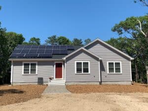 truro house with solar panels with clear skys