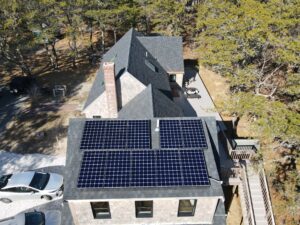 shingled house with rooftop solar panels