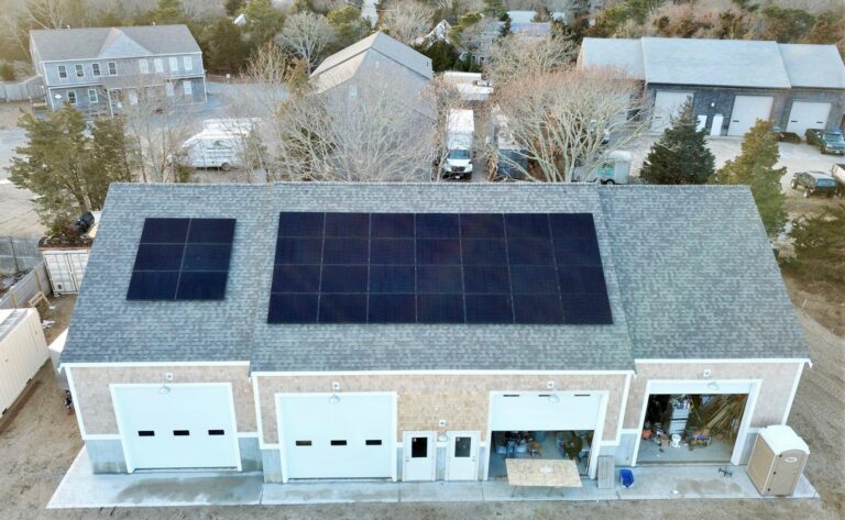 garage with black rooftop solar installation